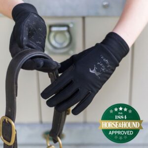 female rider wearing All Purpose riding gloves in black.